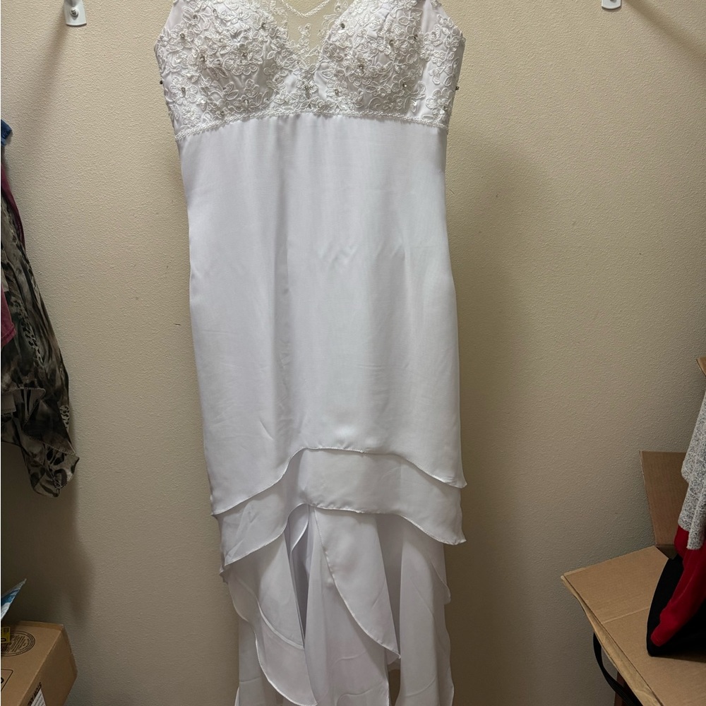 White sleeveless partially embroidered flowy dress